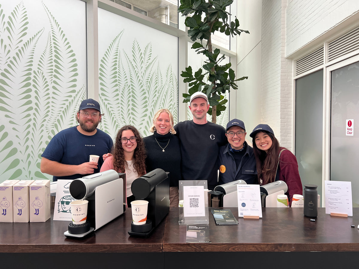 The CRU Kafe team behind a coffee bar